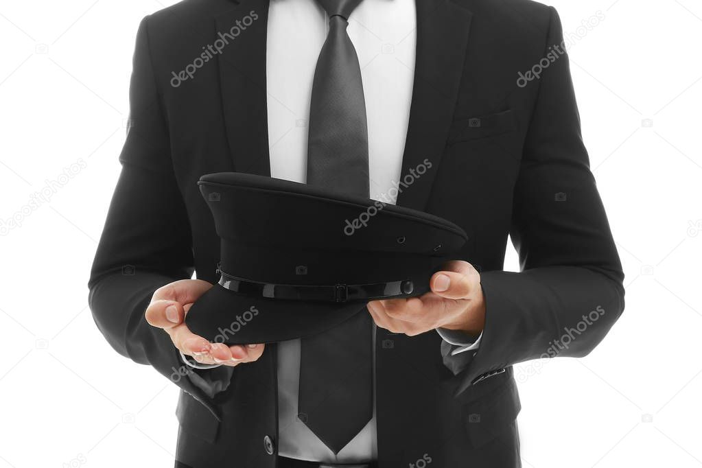chauffeur holding hat