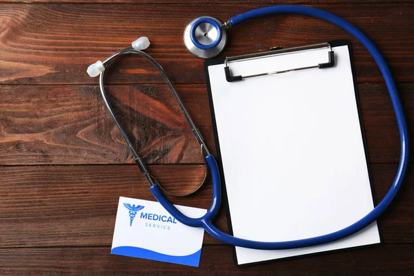 Business card with clipboard and stethoscope