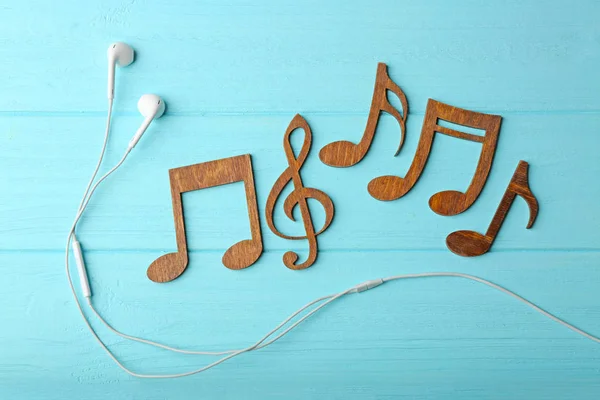 Earphones and music notes — Stock Photo, Image