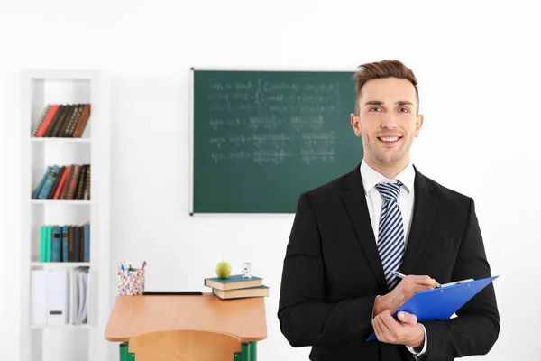 Male teacher in classroom — Stock Photo, Image