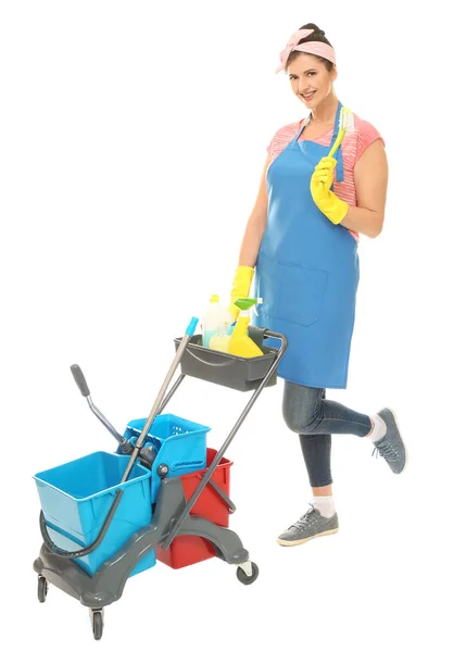 Young cleaner with cart and cleaning supplies on white background — Stock Photo, Image
