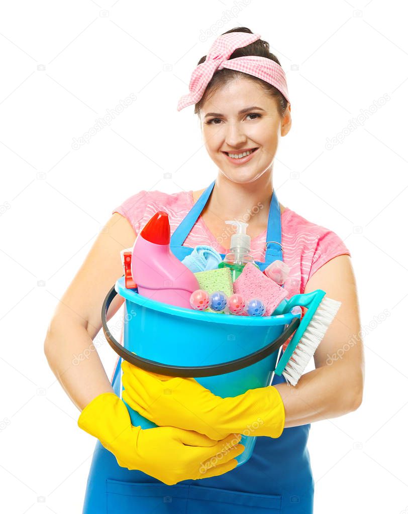 Young cleaner with cleaning supplies in bucket on white background