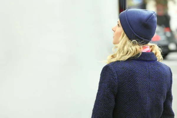 Young woman near public board — Stock Photo, Image