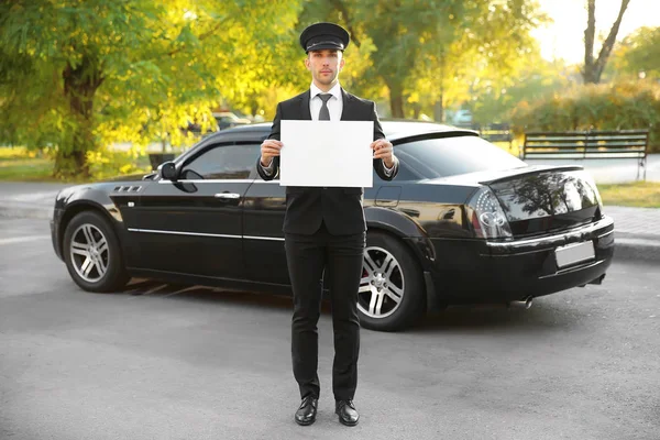 Chauffeur standing with white board — Stock Photo, Image