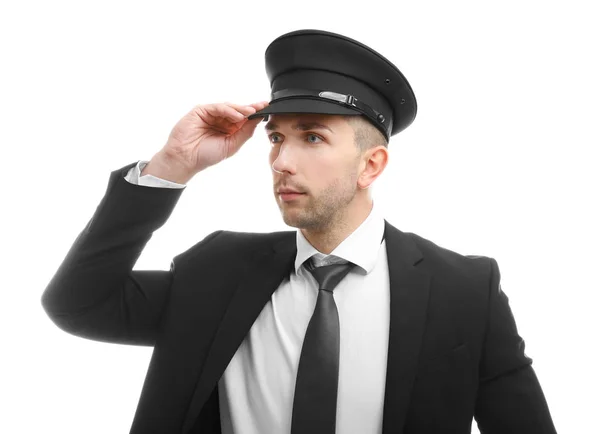 Young chauffeur adjusting hat — Stock Photo, Image