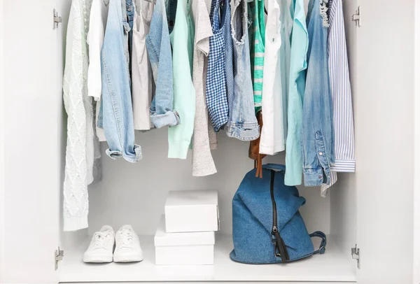 Clothes hanging on rack — Stock Photo, Image