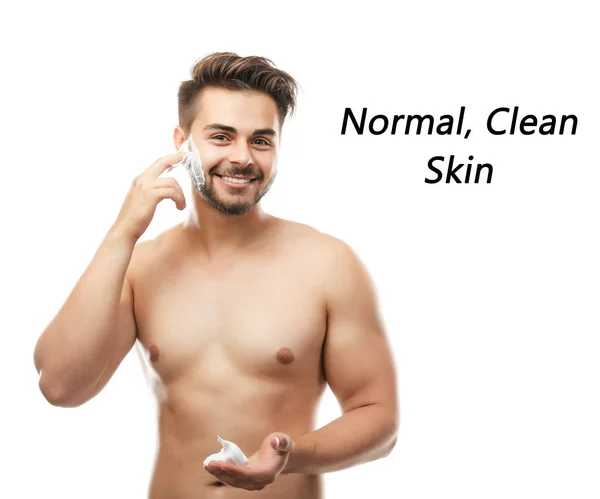 Young man applying shaving foam — Stock Photo, Image