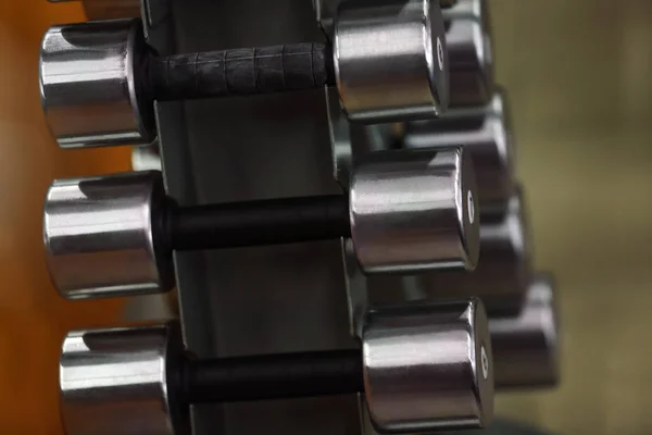 Rack with dumbbells in gym, close up view — Stock Photo, Image