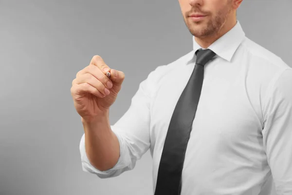 Man writing on virtual screen — Stock Photo, Image