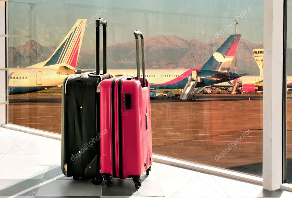 two suitcases at airport
