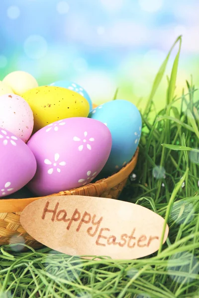 Wicker basket with Easter eggs — Stock Photo, Image