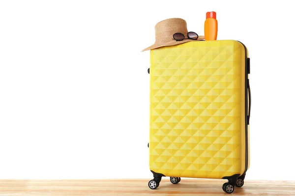 Yellow traveler case with hat — Stok fotoğraf