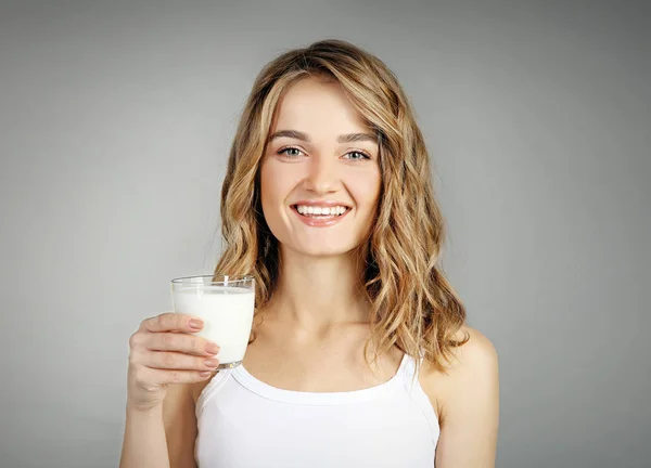 Woman with glass of milk — Stock Photo, Image
