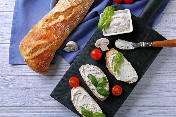 Tasty bruschetta with creamy cheese — Stock Photo, Image