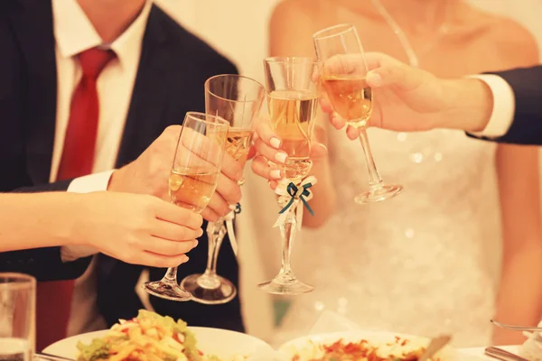 Hands with champagne glasses — Stock Photo, Image