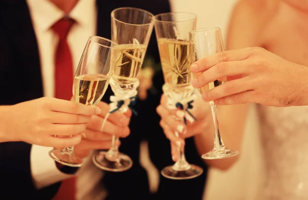 Hands with champagne glasses — Stock Photo, Image