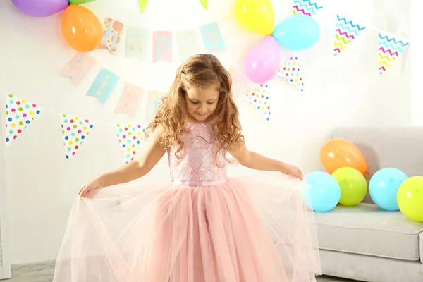 Pretty birthday girl in beautiful dress at home — Stock Photo, Image