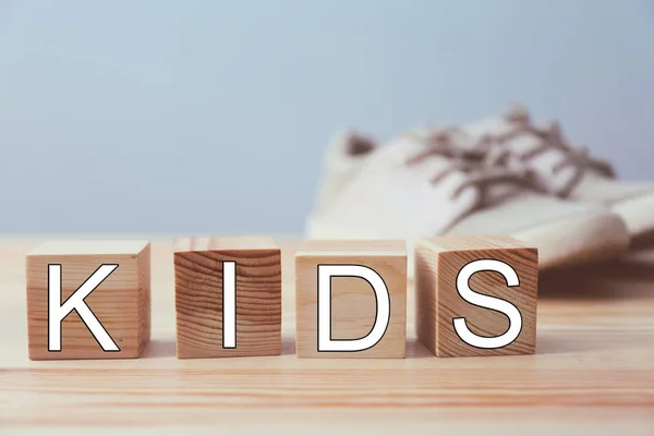 Word KIDS made of wooden cubes a — Stock Photo, Image