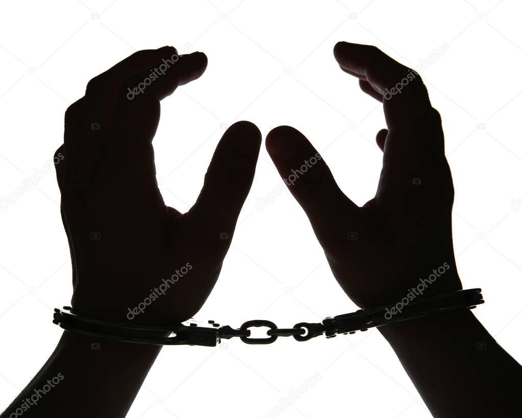 man hands in handcuffs