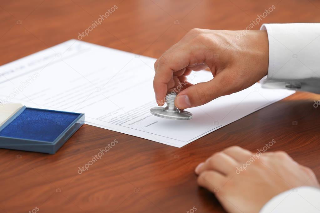 Office stamping document — Stock Photo © belchonock #136299772
