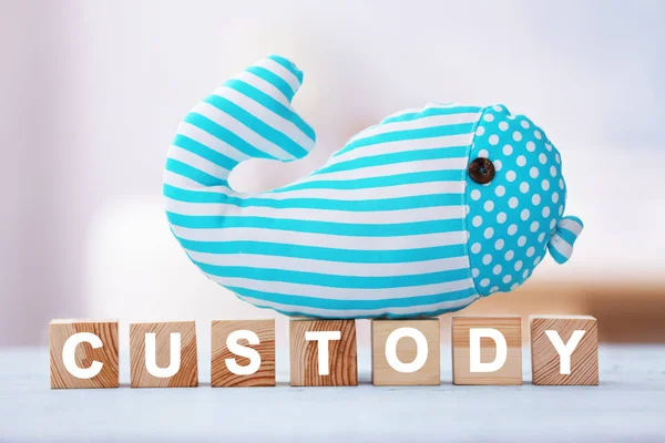 Kubussen met woord en speelgoed walvis — Stockfoto