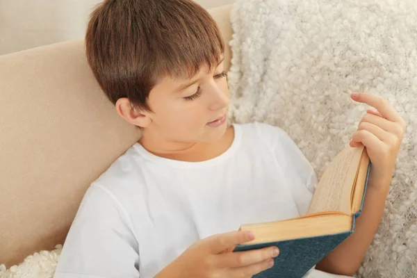 Schoolboy reading book — Stock Photo, Image