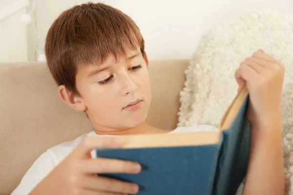 Schoolboy reading book — Stock Photo, Image