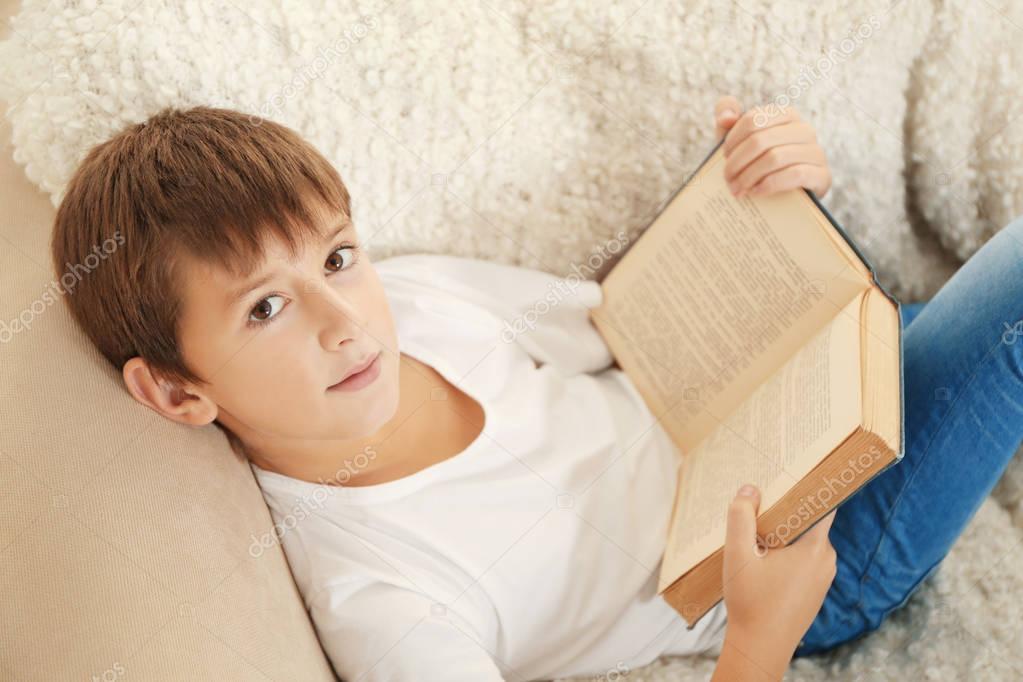 schoolboy reading book