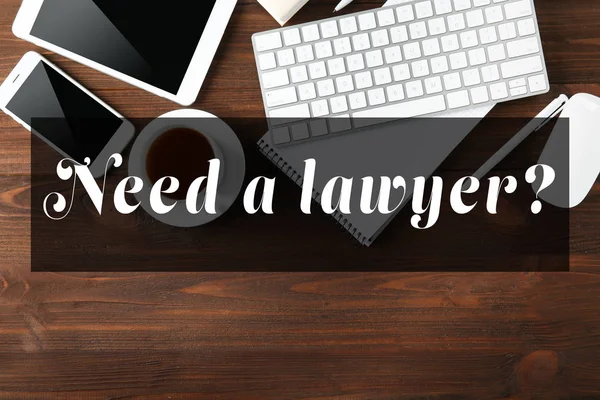 Текст NEED A LAWYER — стокове фото