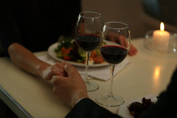 Couple hands in restaurant