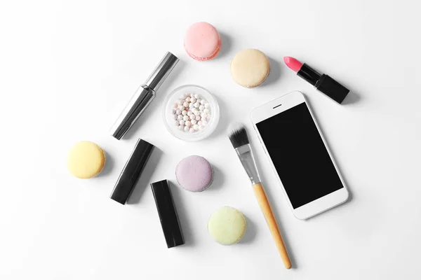 Makeup cosmetic with macaroons — Stock Photo, Image