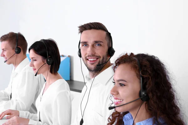 Team of technical support dispatchers working in office