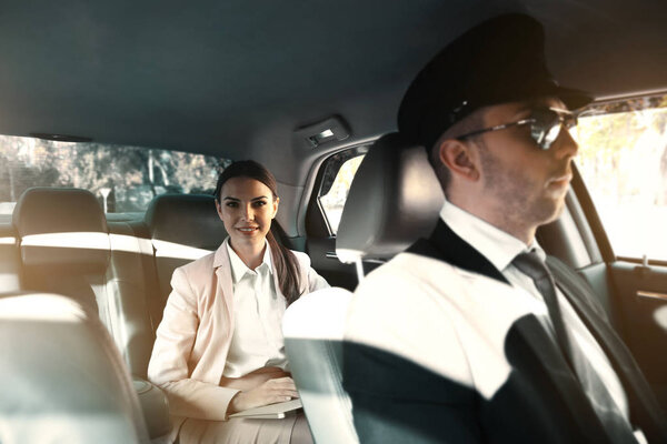 Businesswoman riding car