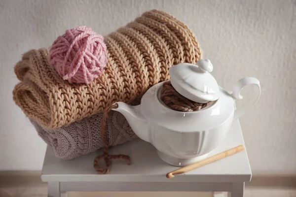 Plaids, yarn and teapot — Stock Photo, Image