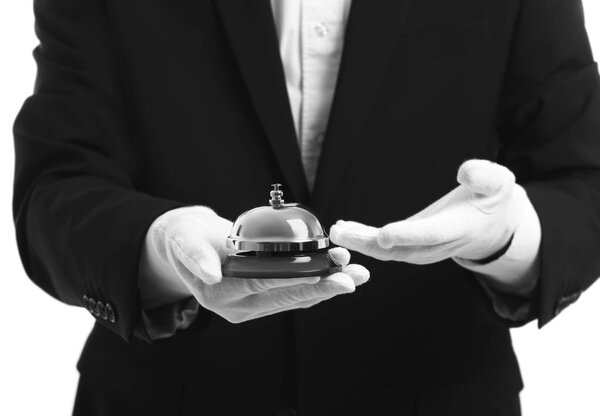 Bellboy holding bell 