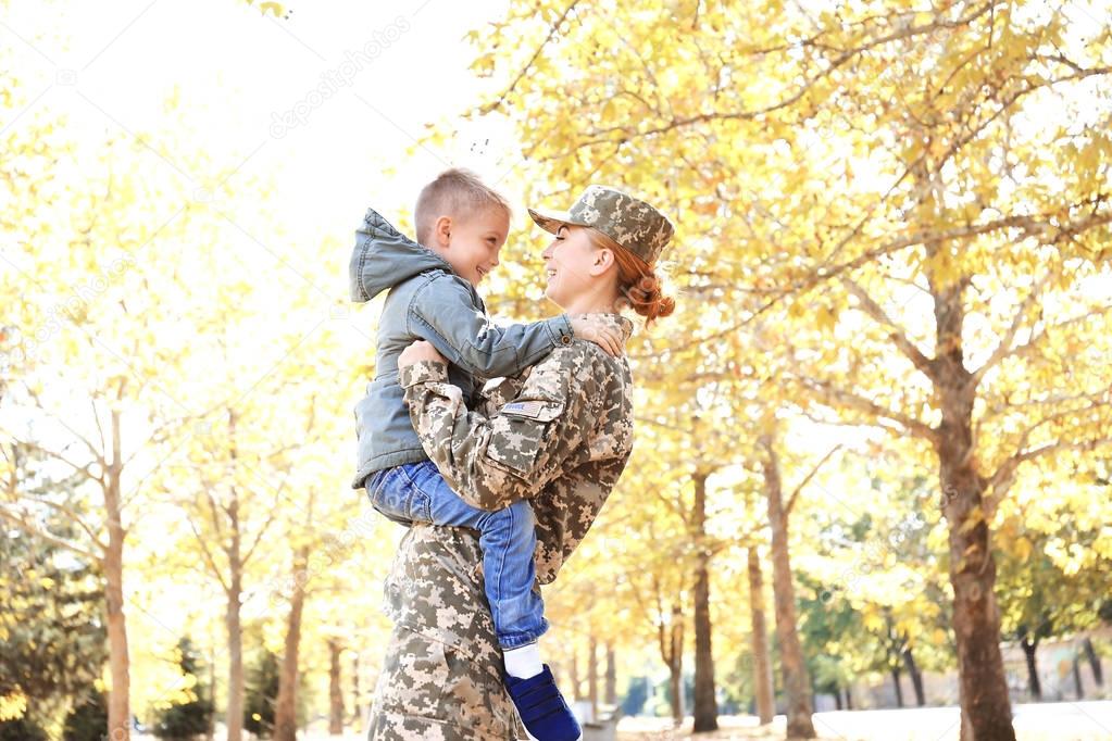 Mother soldier and little kid