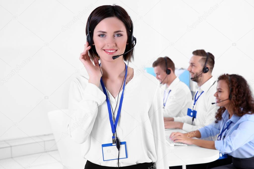 Young female technical support dispatcher working in office, closeup