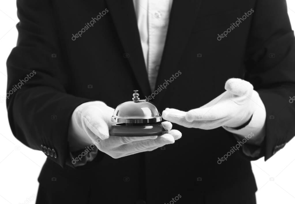 Bellboy holding bell 