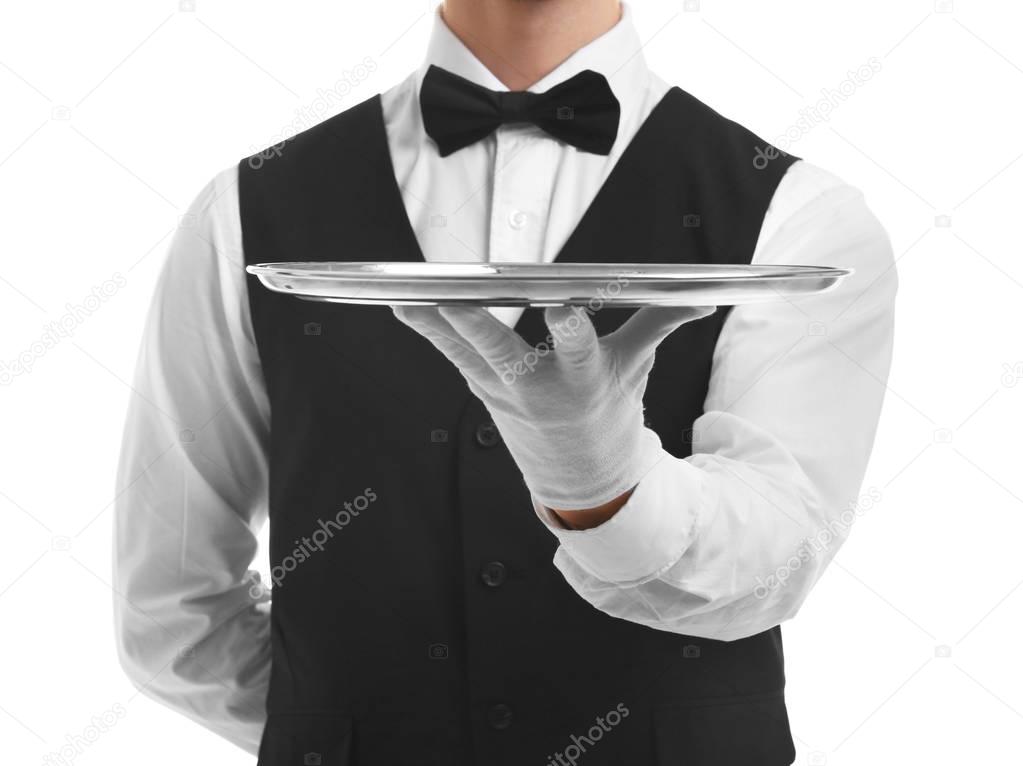 Waiter holding empty silver tray 