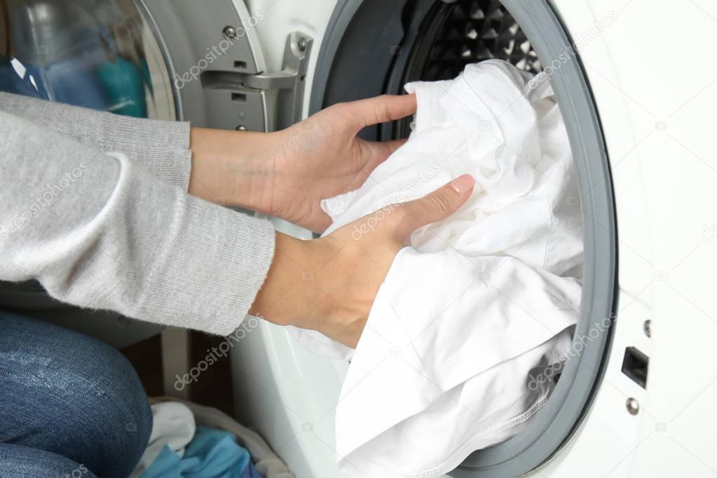 hands getting out clean clothes