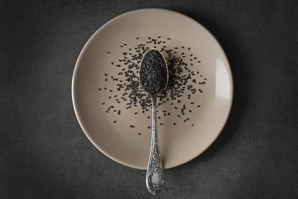 Black sesame in spoon — Stock Photo, Image