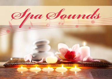 Mumlar ve çakıl taşları ile çiçek 