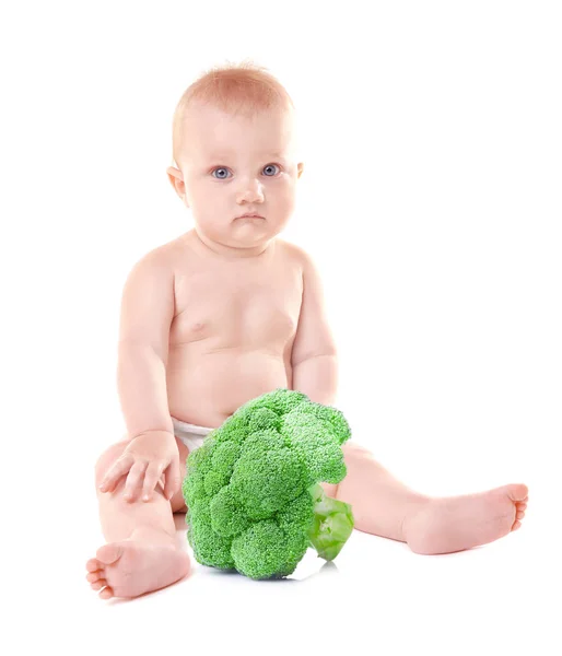 Cute baby with broccoli — Stock Photo, Image