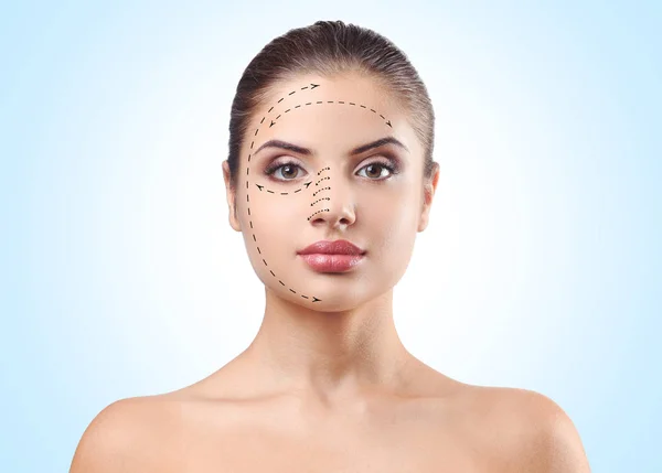 Young Woman Marks Face Blue Background Plastic Surgery Concept — Stock Photo, Image