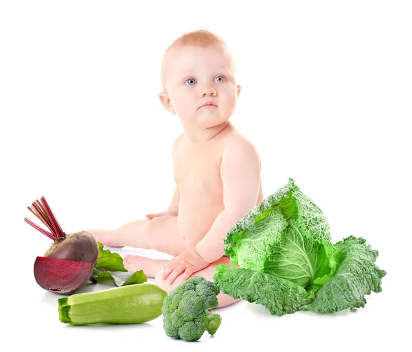 Cute baby with vegetables — Stock Photo, Image