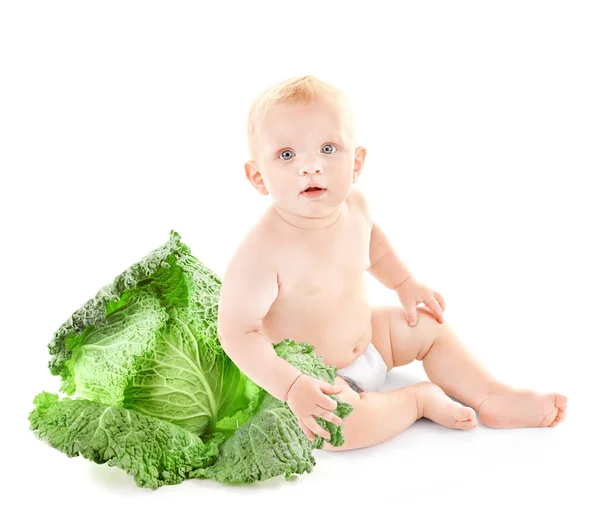 Cute baby with savoy cabbage — Stock Photo, Image