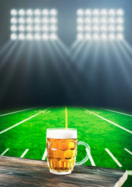 stock image Glass of beer on wooden table 