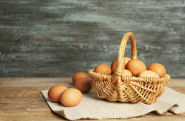Raw eggs in wicker basket