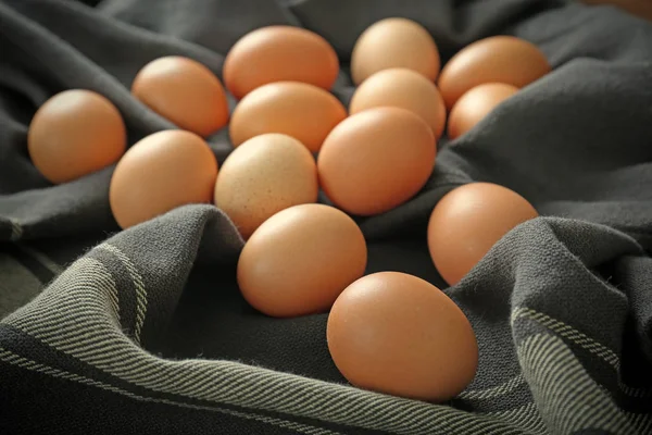 Raw eggs on tablecloth — Stock Photo, Image