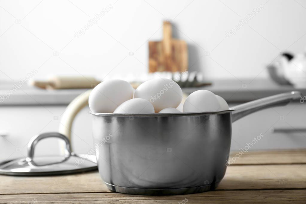 Raw eggs in saucepan